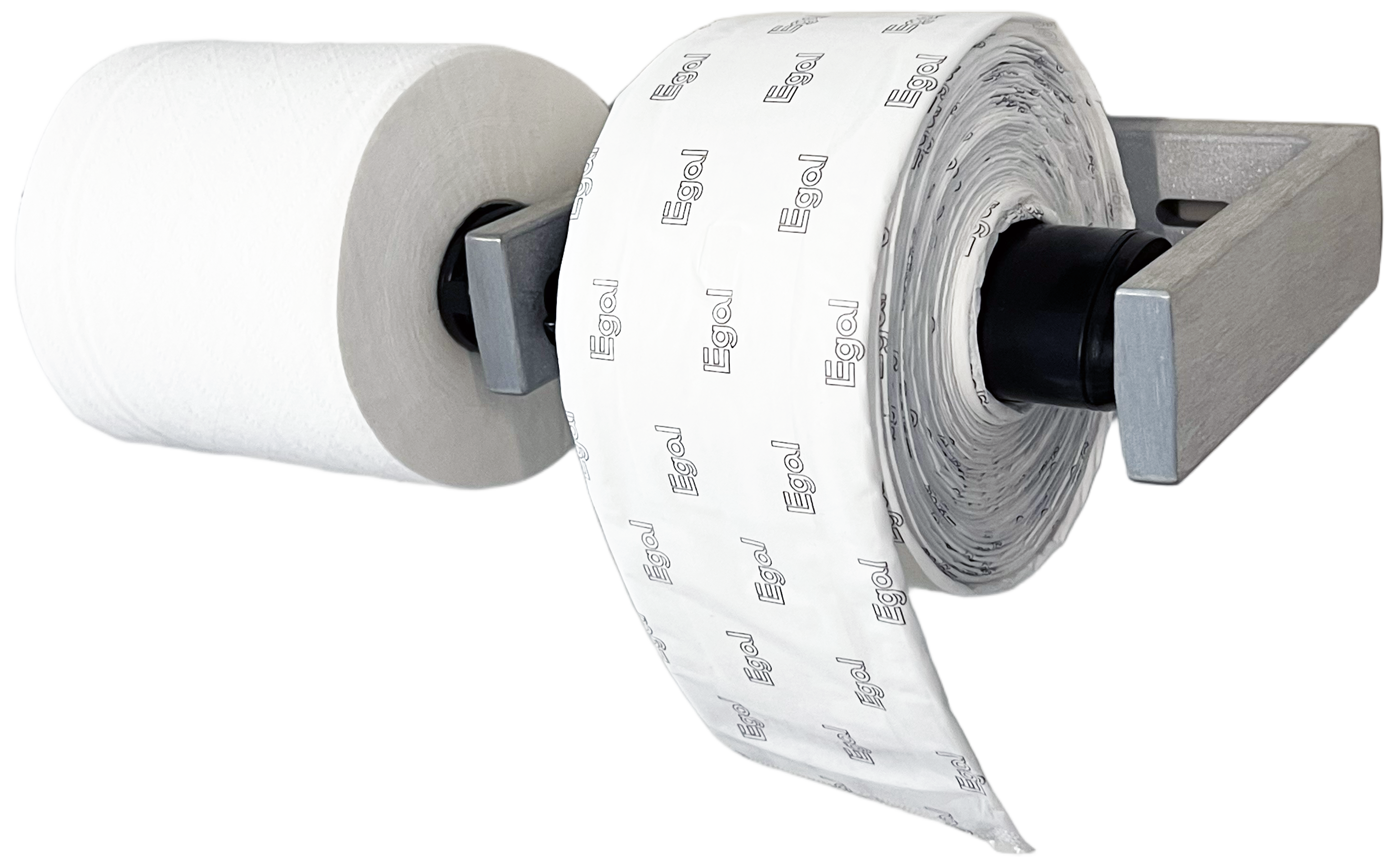 Egal Pads on a Roll mounted on a wall holder next to a toilet paper roll
